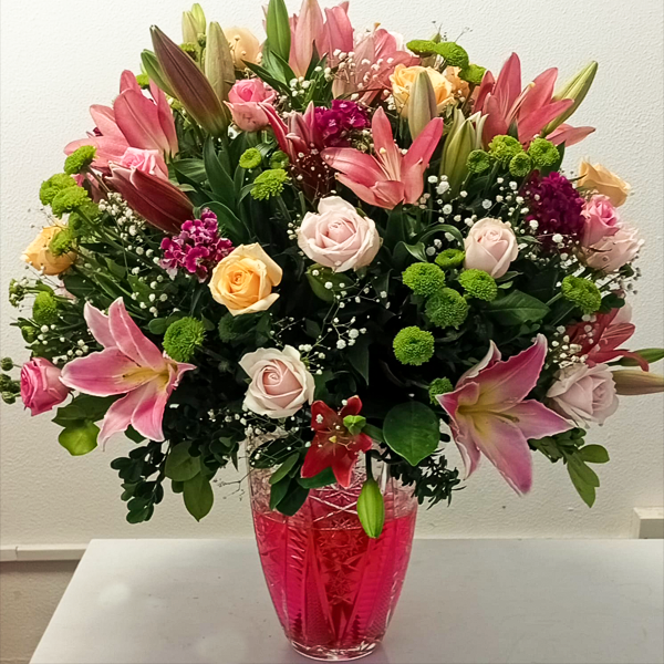 Elegant Pink & Yellow Bloom Arrangement in Crystal Vase